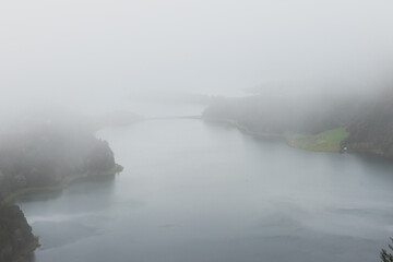 Misty Lake at Dawn: A Serene and Mysterious Landscape