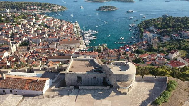 Hvar, Croatia - Drone Aerial View Of Hvar Town And Napoleon Fortress, Croatia. Stunning Drone Footage Showcasing The Panoramic Views Of Hvar Town From The Historic Napoleon Fortress On Hvar Island