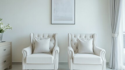 A white living room interior features elegant armchairs and a prominently displayed poster.