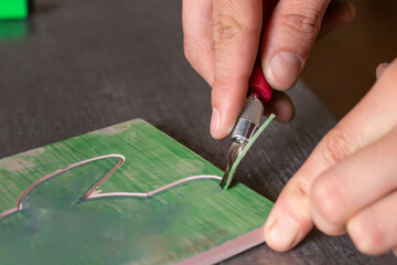 Close up of rubber / linoleum carving for relief printmaking. handmade stamping process
