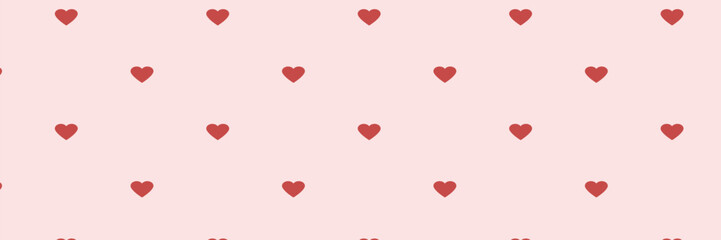Seamless pattern of red hearts on a pale pink background.