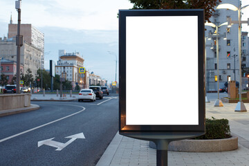 Vertical billboard advertising in the night city. Another open road. Mock-up.