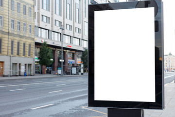 Vertical billboard advertising in the city. Summer morning. Mock-up.