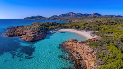 Stunning Aerial View of Serene Beach with Crystal Clear Water, Rocky Coastline, and Lush Greenery Under Brilliant Blue Sky in a Remote Tropical Paradise