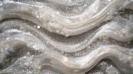 Obraz premium Layered waves of silver and pearl-white glitter creating an undulating textural landscape, reminiscent of flowing mercury. Multiple light sources create complex reflections and shadows, with some