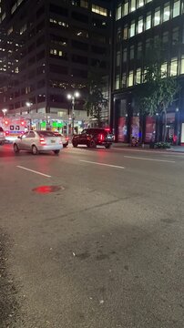 Manhattan, New York, USA - October 9, 2024 - Time lapse video of Third Ave and 43rd Street at night in Manhattan showing cars, trucks and an ambulance 