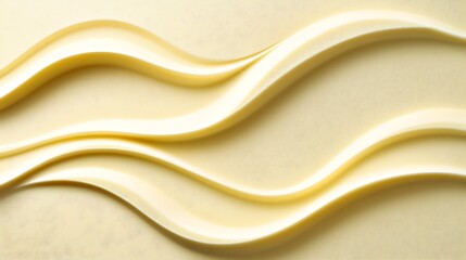 Obraz premium Creamy swirls of pale yellow butter texture background