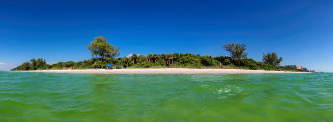 Panoramic view of tropical island. Naples beach in sunny summer day, Florida. Summer vacation and...