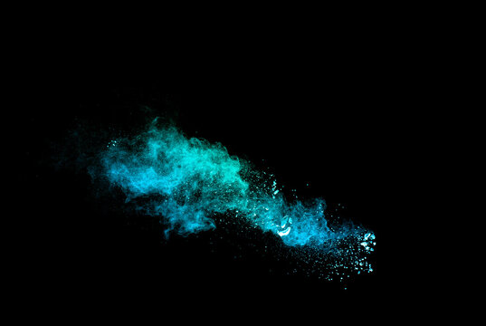 Green Color Powder Explosion Cloud On Black Background. Green Dust Splash On Dark Background.