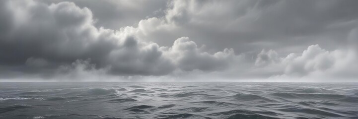 Dense fog bank with gray mist swirling around a still ocean, serene, atmospheric