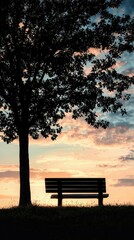 Tranquil Sunset with Bench Silhouette Beneath a Majestic Tree