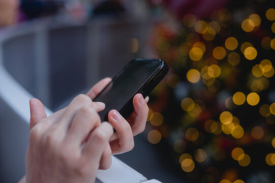 Social media marketing concept. hands using smartphone typing, chatting conversation in chat box icons pop up typing on a phone for communication search networking and texting on a mobile app