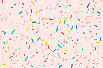 Colorful sprinkles on pastel pink background