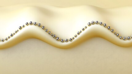 Silver spheres arranged on a wavy beige surface