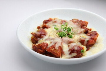 Cheese-Covered Spicy Korean Fried Chicken with Garnish