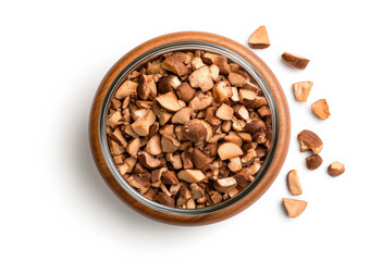 Fototapeta premium Chopped Mushrooms in Bowl: A rustic wooden bowl overflows with roughly chopped brown mushrooms, ready for culinary creation. A few pieces spill artfully onto the surface.