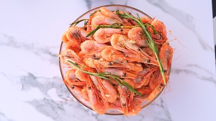 Exquisite seafood meal fresh shrimp cooked with garlic and rosemary Aromatic shrimp served on plate, perfect for gourmet dining. Shrimp infused with herbs creates flavorful and elegant dish.