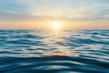 Ocean water surface concept. Serene ocean waves at sunset with a colorful sky above.