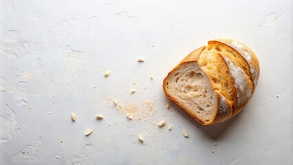 A freshly baked loaf of artisan bread, sliced and presented on a textured surface with crumbs, showcasing its airy crumb and golden crust