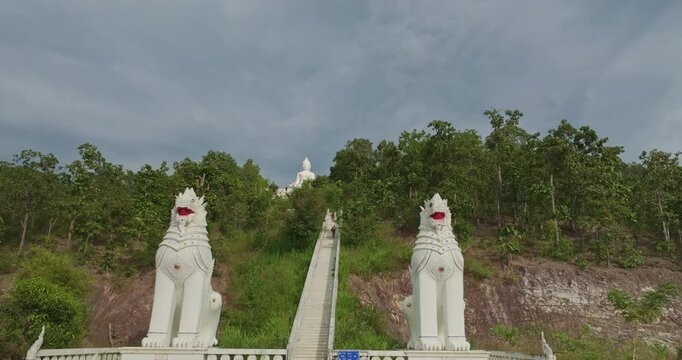 Aerial view Wat Phra That Mae Yen, an ancient temple that has been a symbol of Pai for a long time. Phra Phuttha Lokuttara Mahamuni, a large white Buddha statue in the Mara-Vijaya attitude on hilltop
