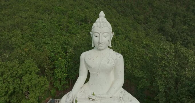 Aerial view Wat Phra That Mae Yen, an ancient temple that has been a symbol of Pai for a long time. Phra Phuttha Lokuttara Mahamuni, a large white Buddha statue in the Mara-Vijaya attitude on hilltop