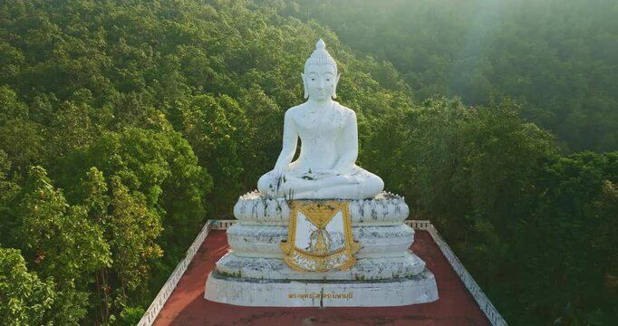 Aerial view Wat Phra That Mae Yen, an ancient temple that has been a symbol of Pai for a long time. Phra Phuttha Lokuttara Mahamuni, a large white Buddha statue in the Mara-Vijaya attitude on hilltop