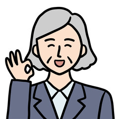 OKポーズをするスーツ姿のシニア女性（笑顔）