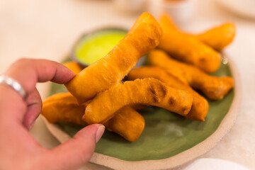 The breakfast made from fried flour is called Patongo on man hand