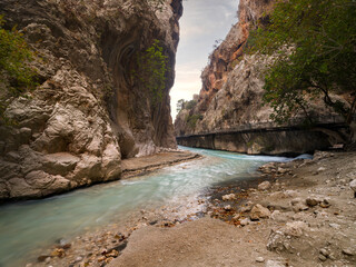 Fototapeta premium Saklikent Canyon. The spring water comes naturally from the mountains and flows between the rocks. Saklikent National Park. Travelling to Turkey country. Fethiye district, Mugla province 
