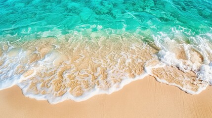 Obraz premium serene beach scene featuring turquoise water gently lapping at golden sand, creating peaceful and inviting atmosphere. sunlight enhances vibrant colors of ocean