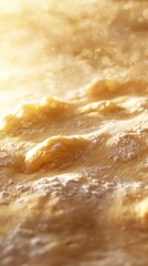 Obraz premium Textured Surface of Golden Dough with Soft Bumps and Light Effects