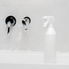 A white bottle of anti-fouling agent in the bathroom