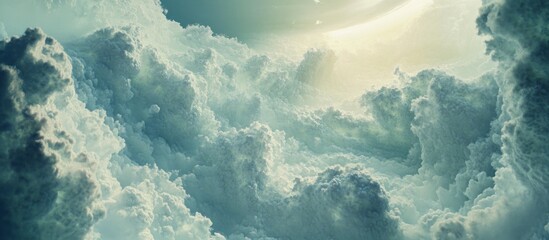 Dramatic cloudscape with light shining through dense cumulus clouds.