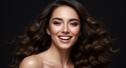 Obraz premium Beauty brunette girl with long shiny curly hair . Beautiful smiling woman model wavy hairstyle . Cosmetology, cosmetics and make-up. 