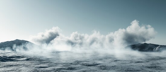 Obraz premium Misty, snowy landscape with mountains and clouds.
