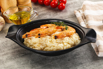 Italian risotto with prawn served thyme