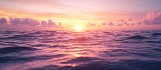 Obraz premium Serene sunset over calm ocean waves.