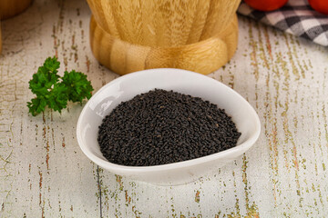 Black dry Nigella seeds in the bowl