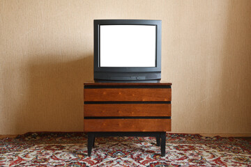 Old TV with white screen on vintage nightstand, vintage design in 80s and 90s style.