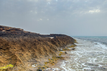Harmony of Land and Sea: Rimel's Mountainous Landscape Meets Tranquil Beach in Bizerte, Tunisia