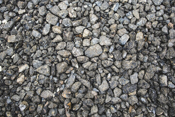 Texture of crushed stone. Gravel close-up. Small stones. Material for construction.