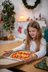 Experience the Festive Pizza Delight Alongside a Happy Child in a Cozy, Inviting Room