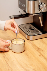The process of making coffee at home. Coffee machine. Ground coffee.