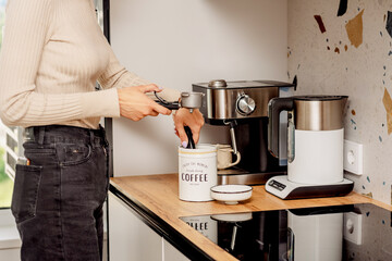 The process of making coffee at home. Coffee machine. Ground coffee.
