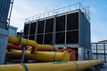 Cooling tower and pipe for air condition System (HVAC) in Factory. Cooling tower for air...