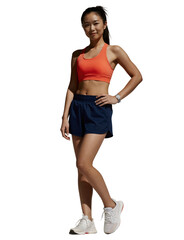 Fototapeta premium A photograph of an athletic Asian woman with a ponytail, wearing a red sports bra, blue shorts, and white sneakers. white background