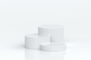 Three white cylindrical podiums of varying heights arranged in minimalist style, set on clean white background, perfect for showcasing products or elegant presentations, 3d rendering
