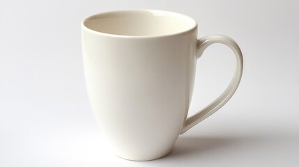 Obraz premium Empty white ceramic mug with handle, isolated on white background.