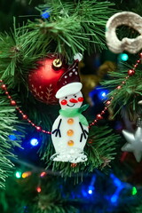 Christmas toys on an artificial Christmas tree close-up