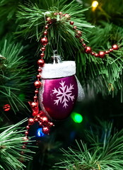 Christmas toys on an artificial Christmas tree close-up